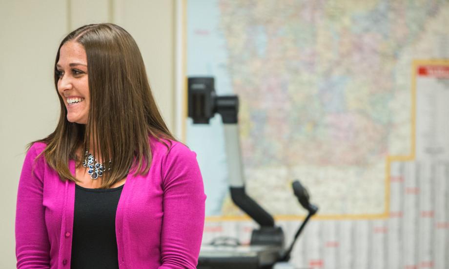 A student in Carthage's Adult Undergraduate Studies program presents during a class.